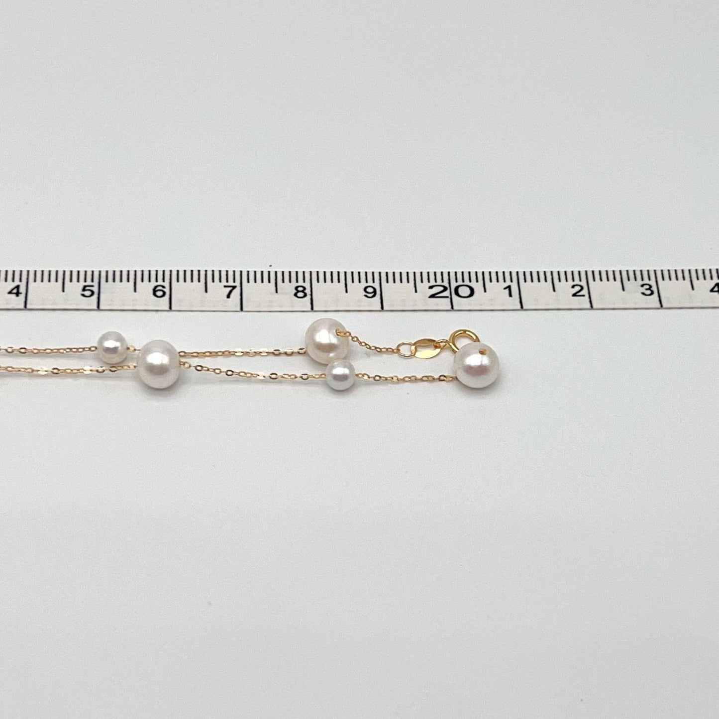 Starlight. 4-7mmWhite Pearl Necklace in 18K Gold
