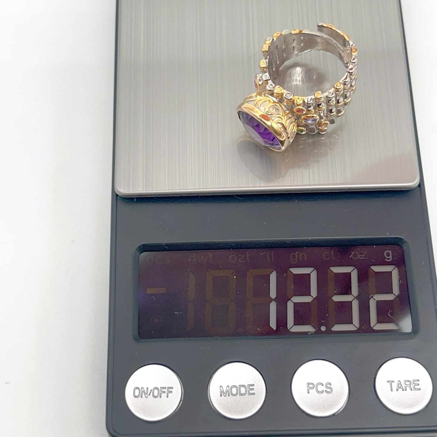 Retro Wind. Ring of Amethyst in Silver. Round Multi-color Zircon