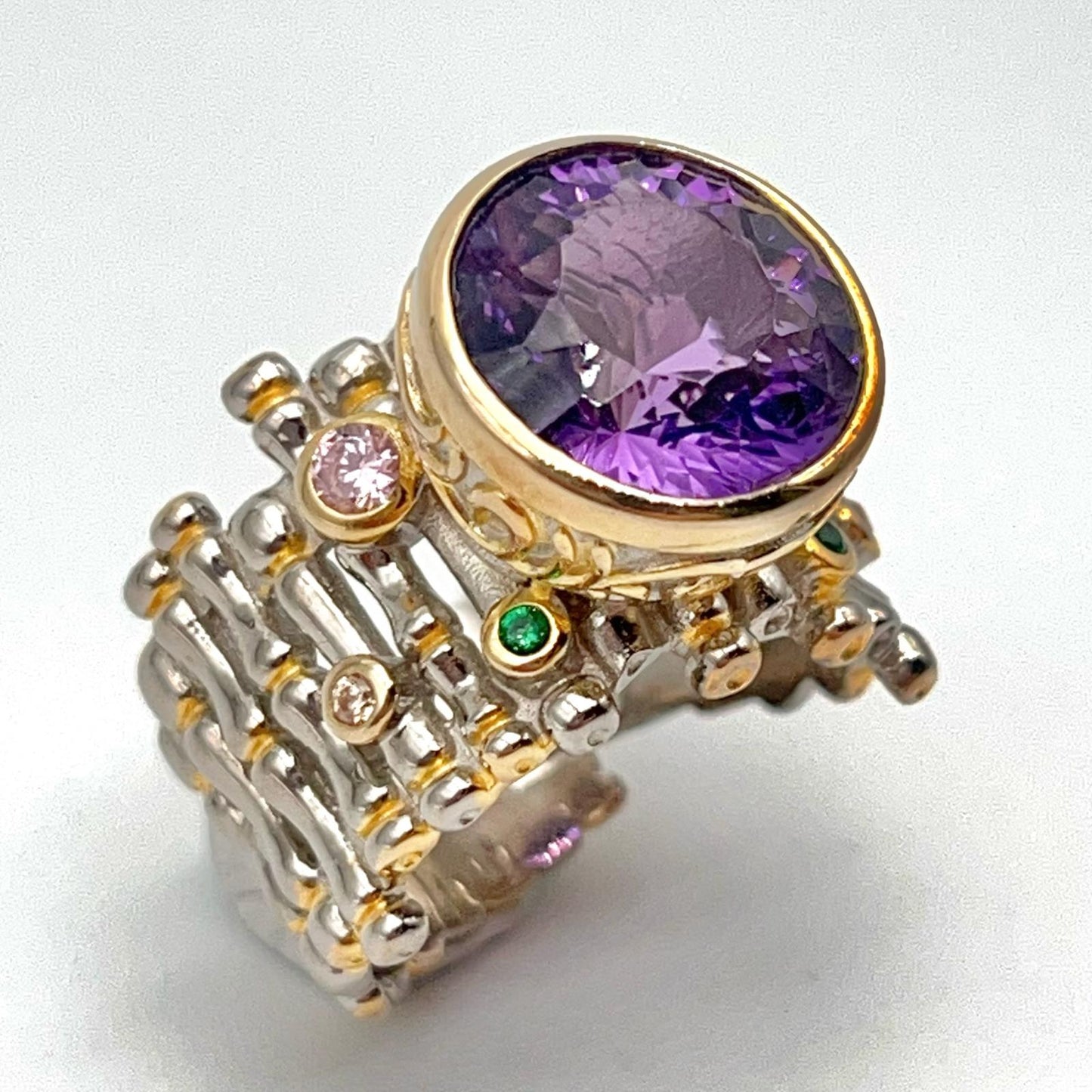 Retro Wind. Ring of Amethyst in Silver. Round Multi-color Zircon