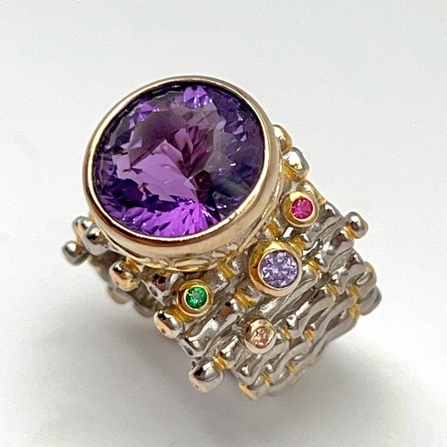 Retro Wind. Ring of Amethyst in Silver. Round Multi-color Zircon