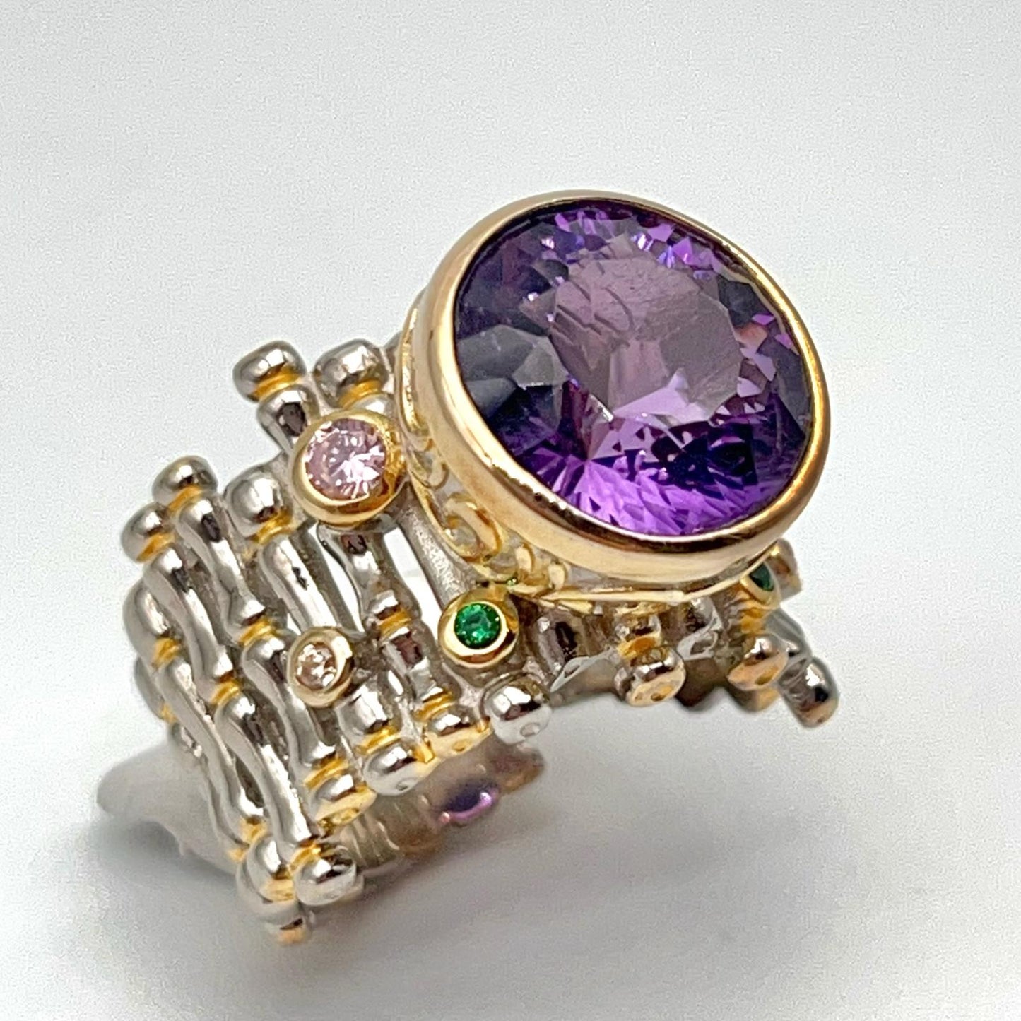 Retro Wind. Ring of Amethyst in Silver. Round Multi-color Zircon