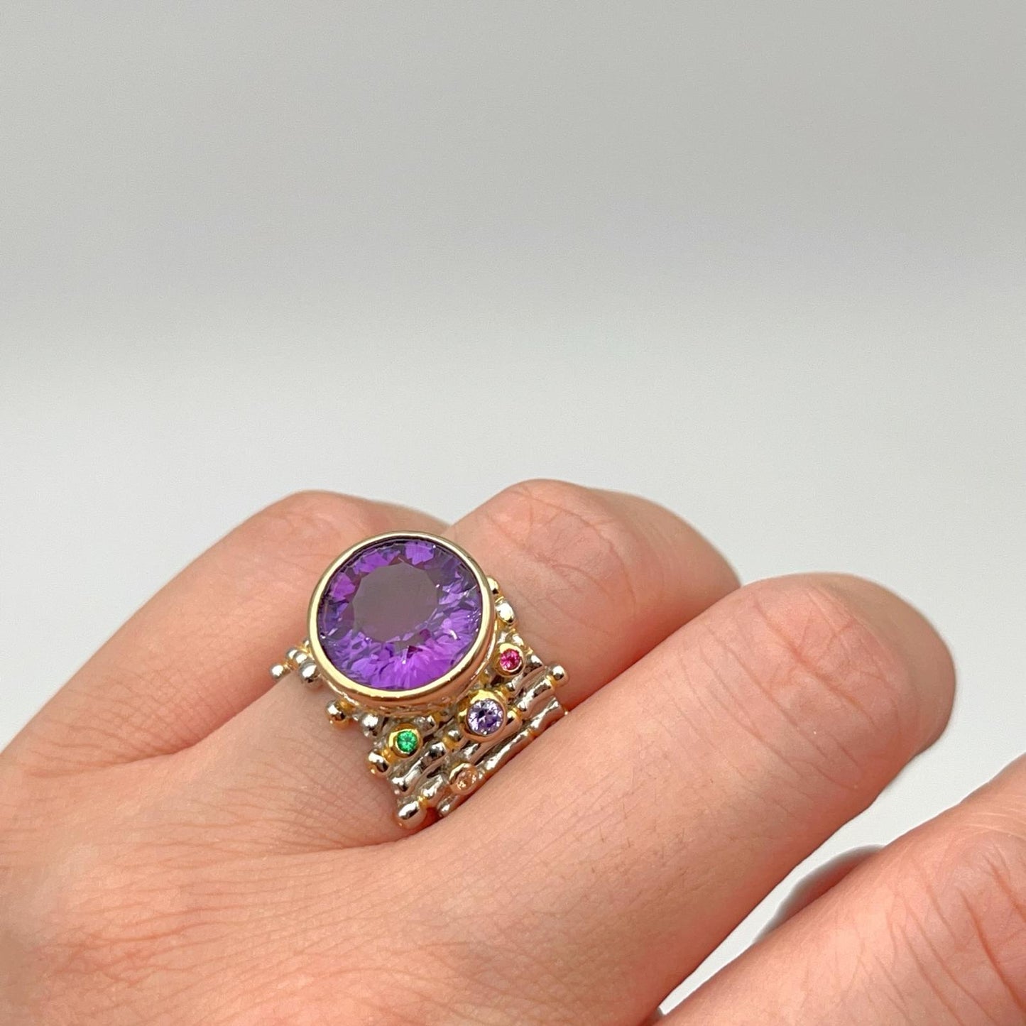 Retro Wind. Ring of Amethyst in Silver. Round Multi-color Zircon