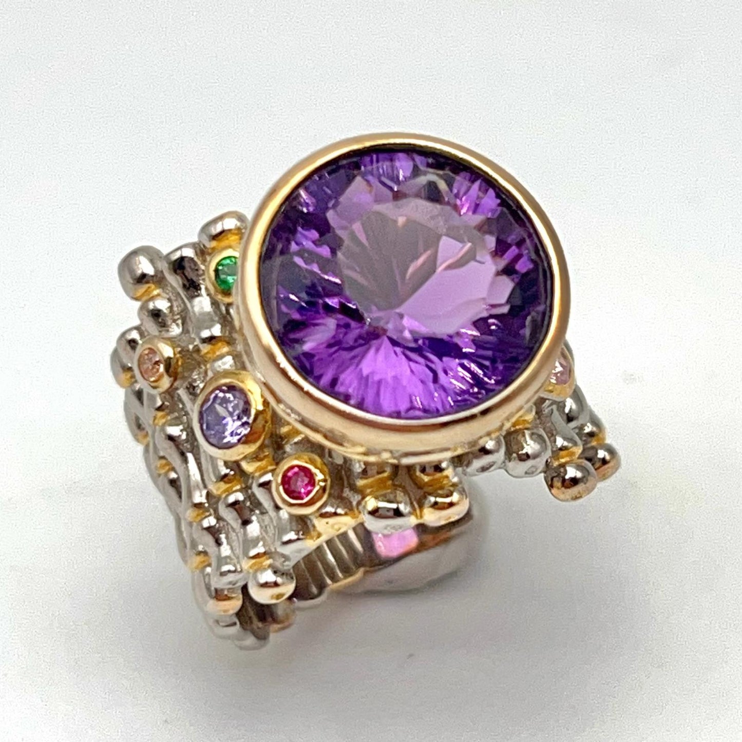 Retro Wind. Ring of Amethyst in Silver. Round Multi-color Zircon