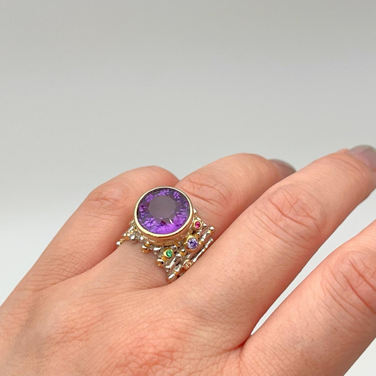 Retro Wind. Ring of Amethyst in Silver. Round Multi-color Zircon