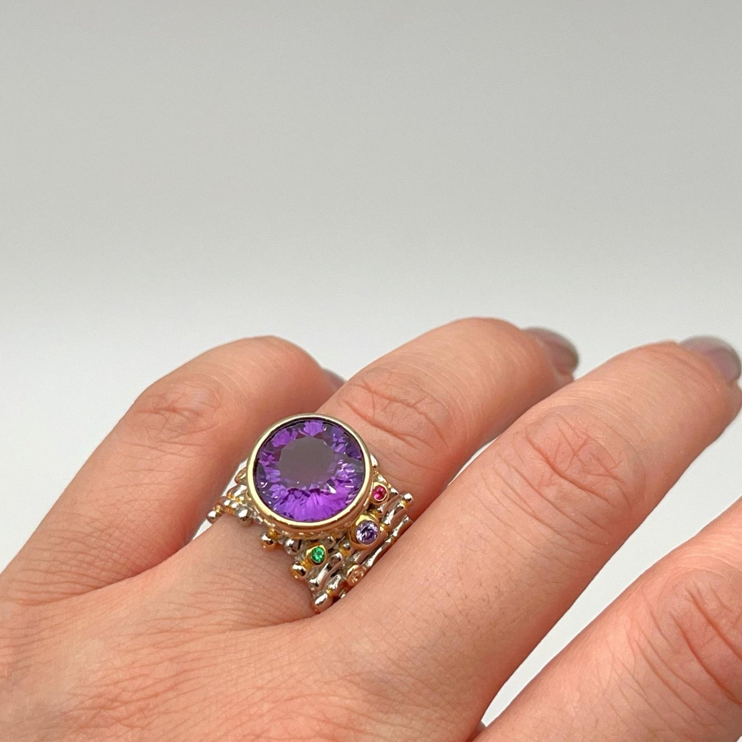 Retro Wind. Ring of Amethyst in Silver. Round Multi-color Zircon