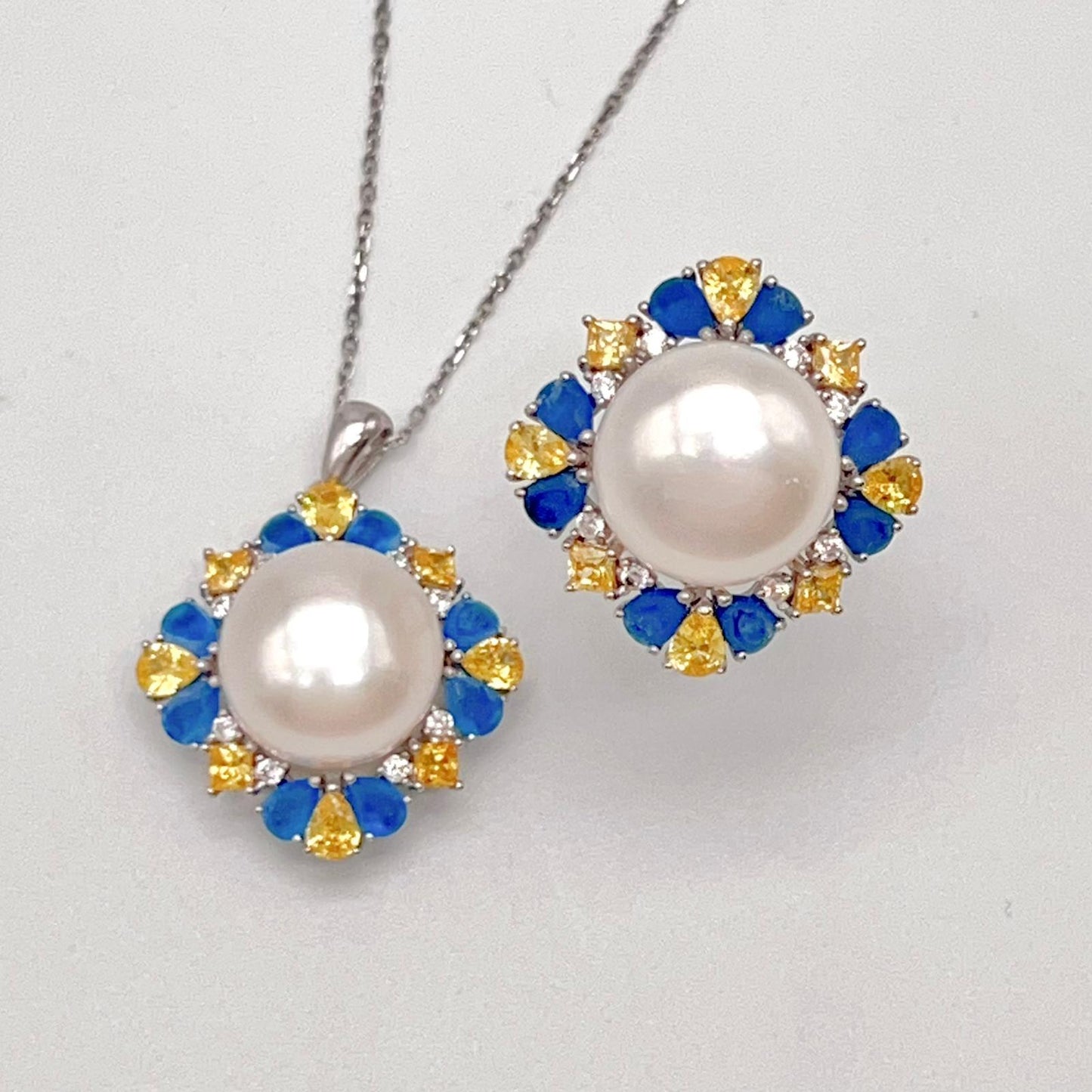 Retro Wind. Pearl Ring and Pendant set in Silver 925. Blue yellow Zircon