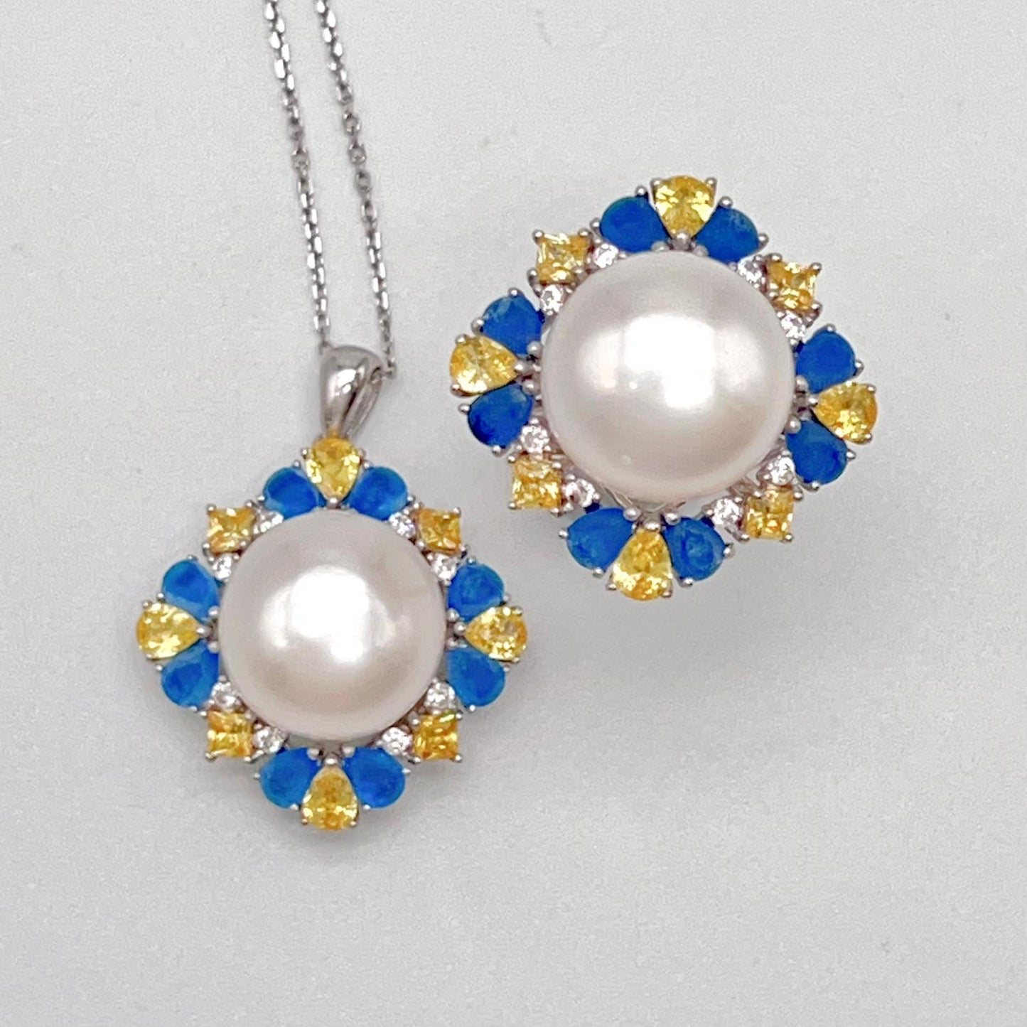 Retro Wind. Pearl Ring and Pendant set in Silver 925. Blue yellow Zircon