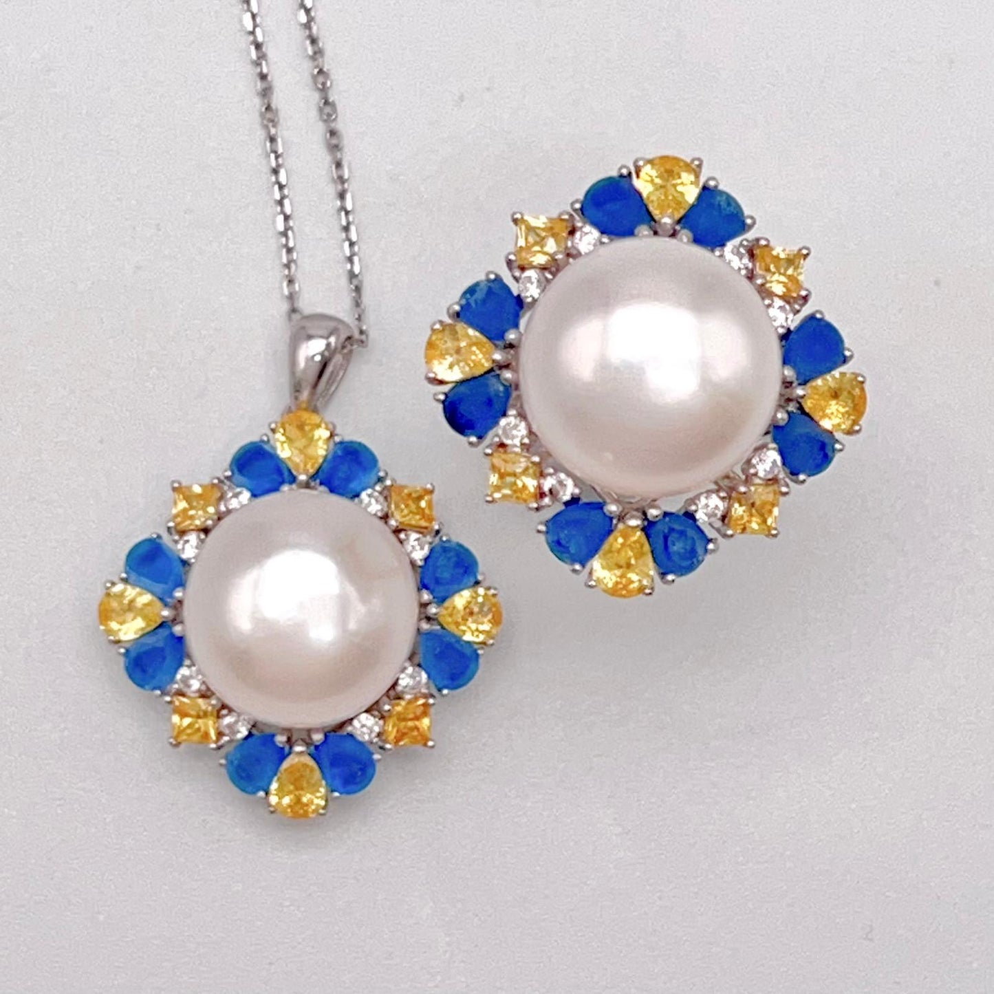 Retro Wind. Pearl Ring and Pendant set in Silver 925. Blue yellow Zircon