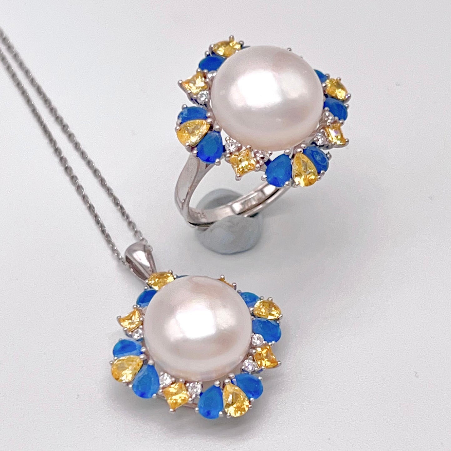 Retro Wind. Pearl Ring and Pendant set in Silver 925. Blue yellow Zircon