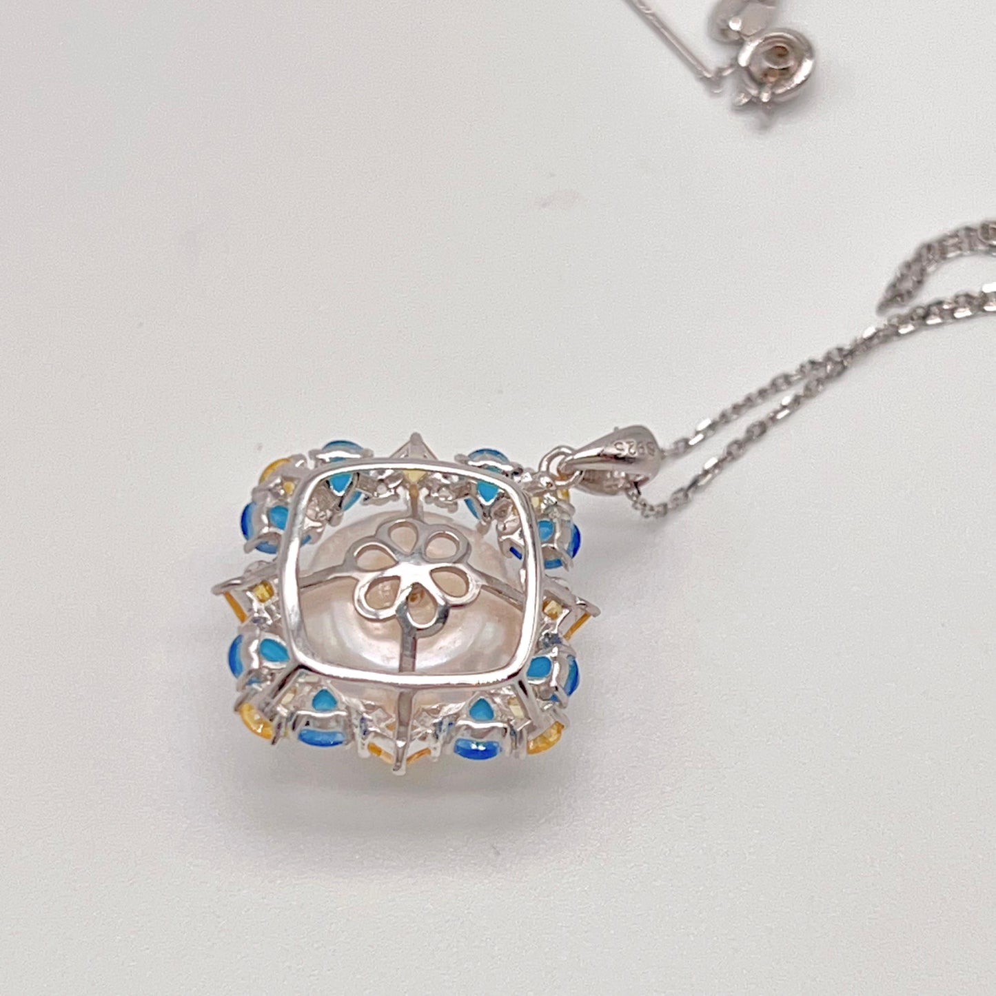 Retro Wind. Pearl Ring and Pendant set in Silver 925. Blue yellow Zircon