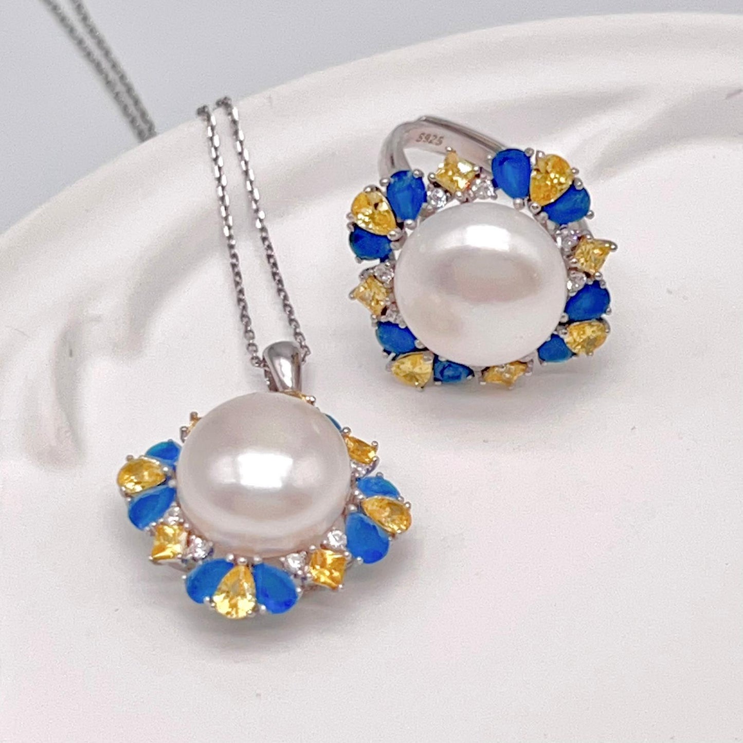 Retro Wind. Pearl Ring and Pendant set in Silver 925. Blue yellow Zircon