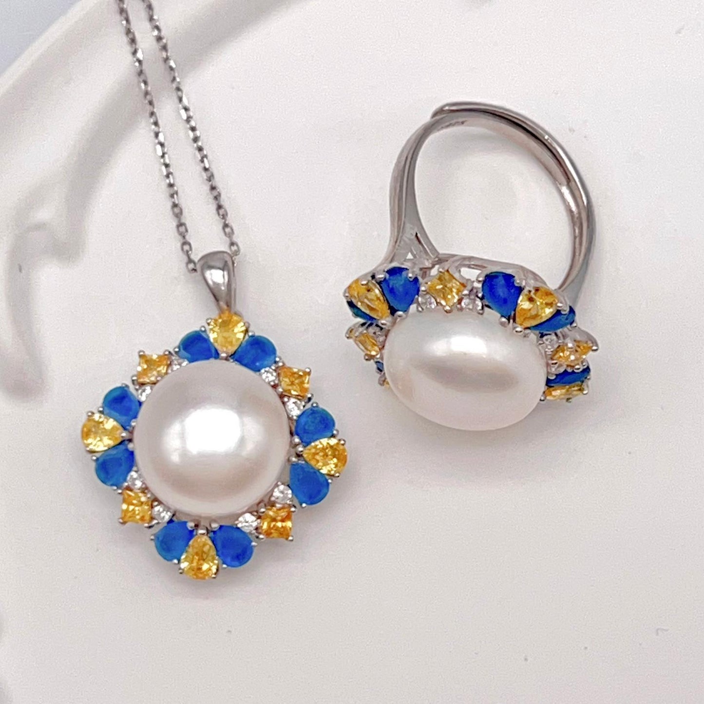 Retro Wind. Pearl Ring and Pendant set in Silver 925. Blue yellow Zircon