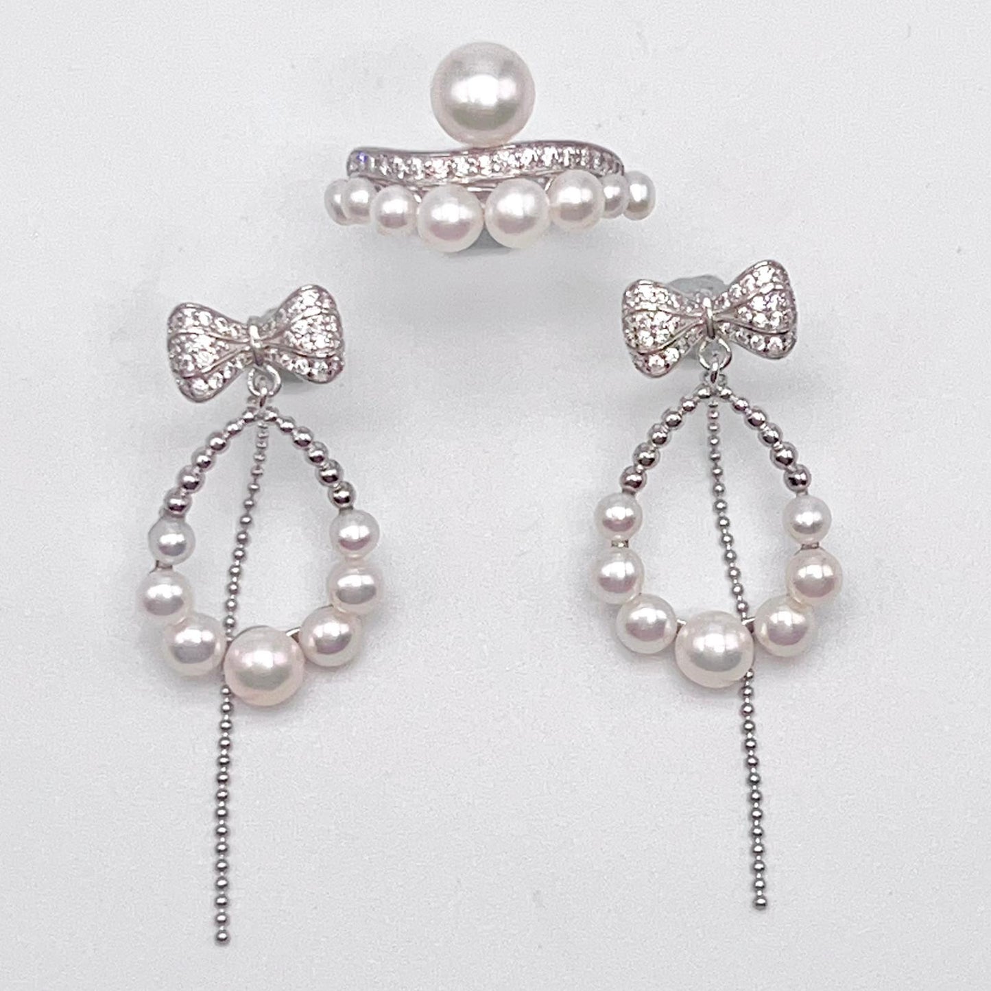Retro Wind. Pearl Earring and Ring set in Silver 925. Bow & Swing
