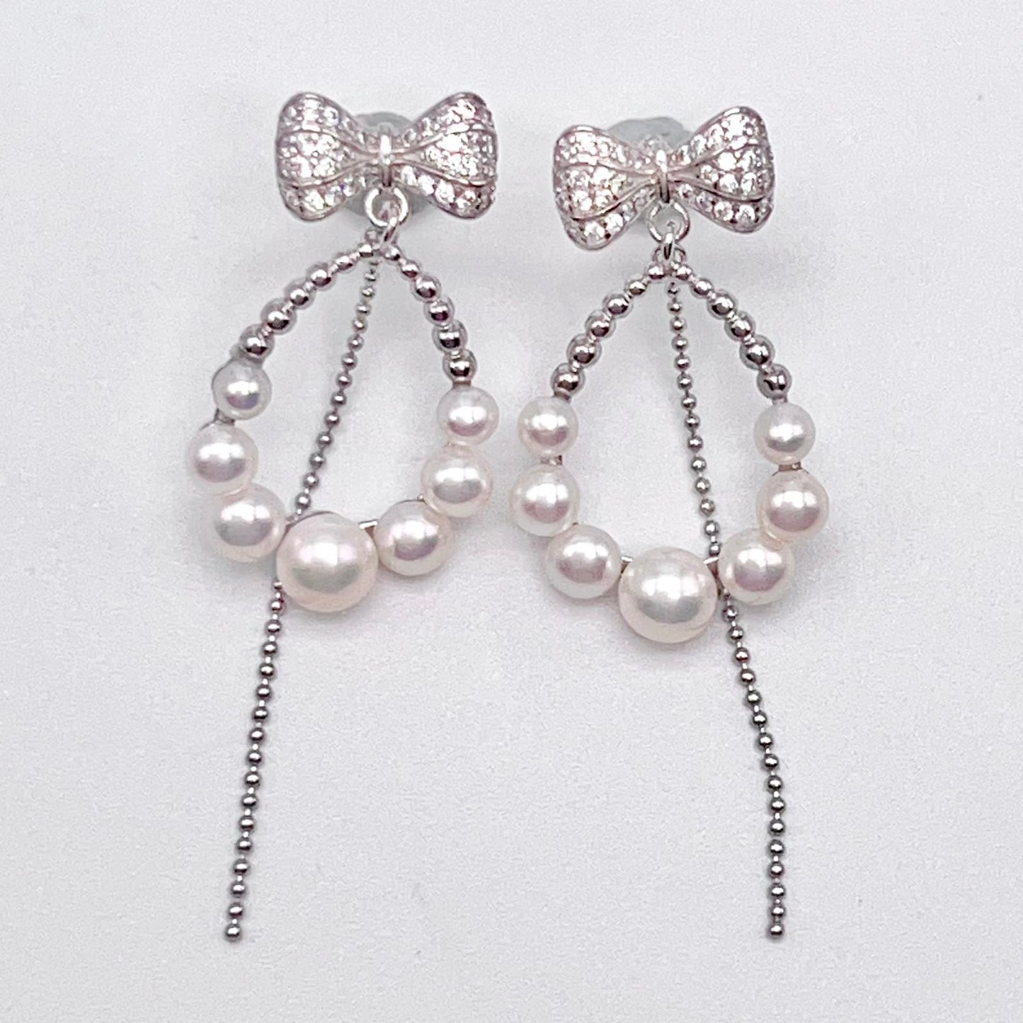 Retro Wind. Pearl Earring and Ring set in Silver 925. Bow & Swing