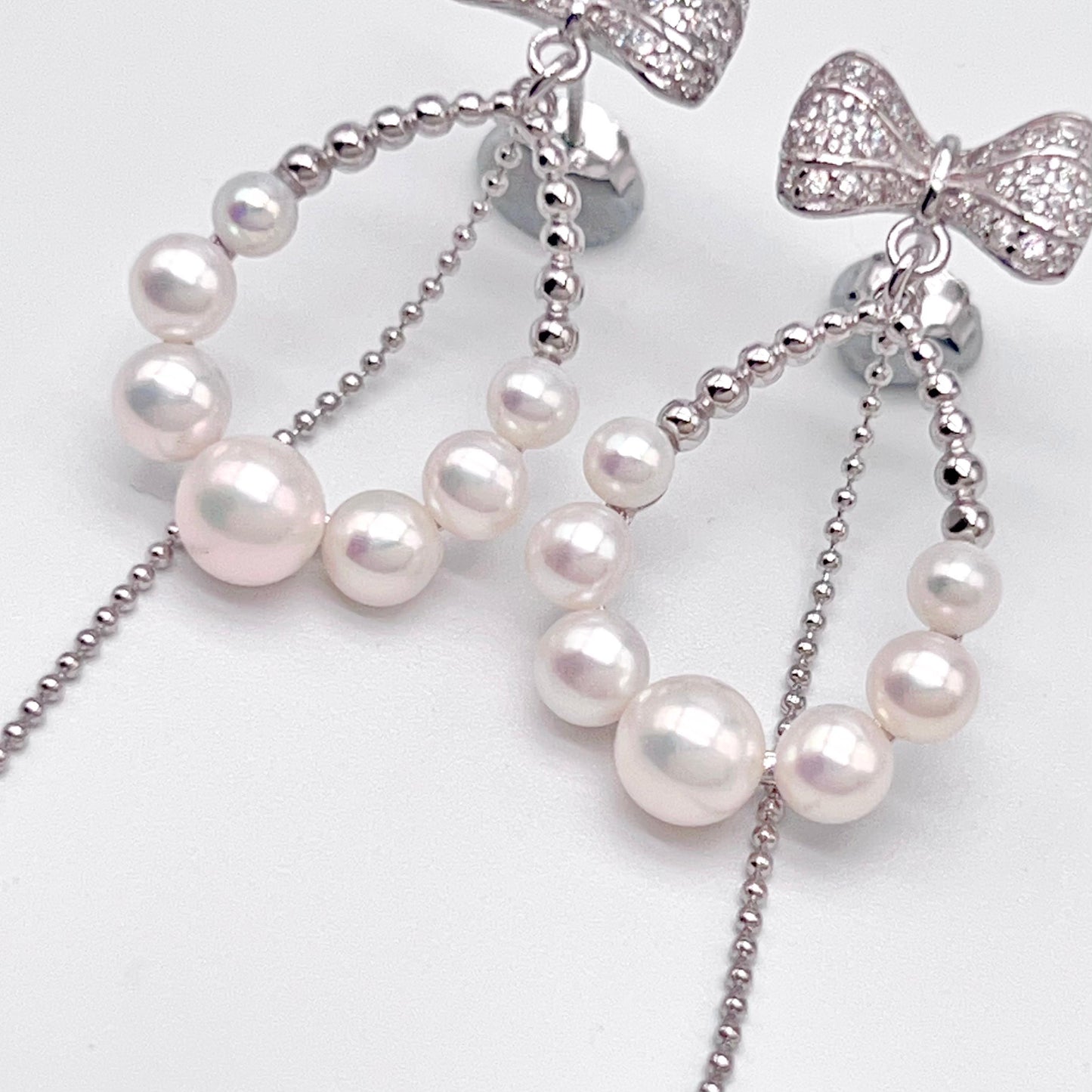 Retro Wind. Pearl Earring and Ring set in Silver 925. Bow & Swing