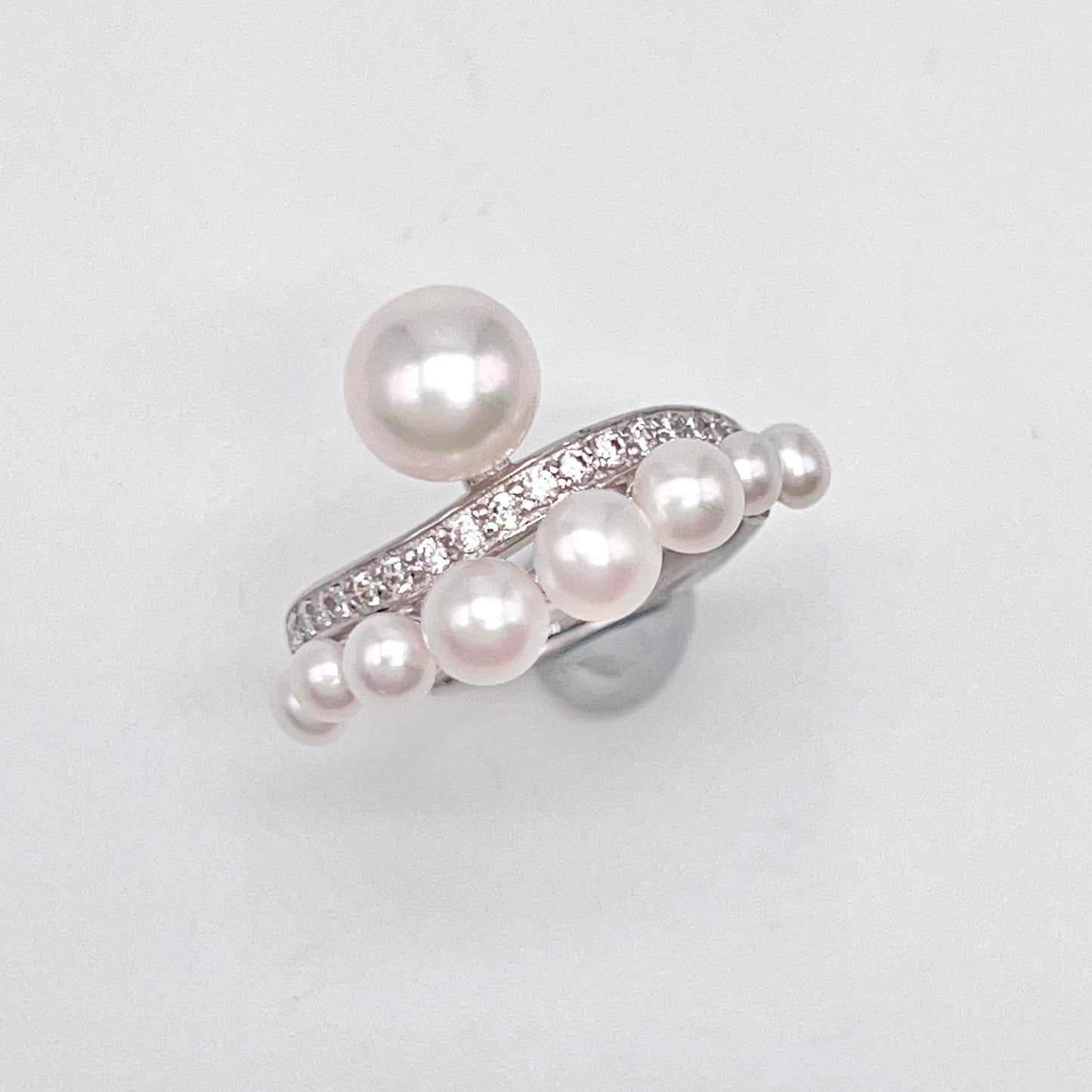 Retro Wind. Pearl Earring and Ring set in Silver 925. Bow & Swing