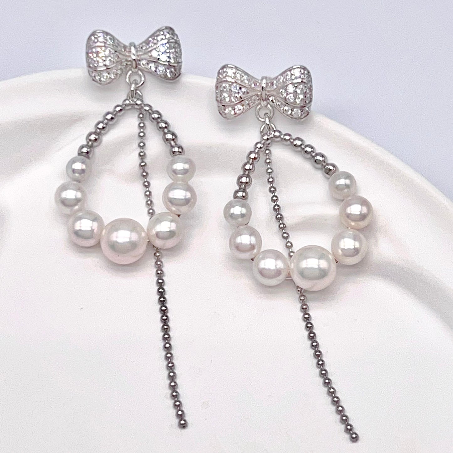 Retro Wind. Pearl Earring and Ring set in Silver 925. Bow & Swing