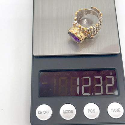 Retro Wind. Ring of Amethyst in Silver. Round Multi-color Zircon