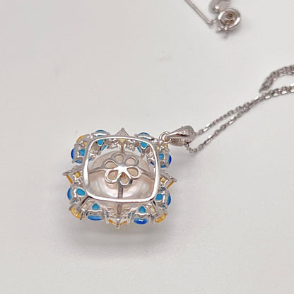 Retro Wind. Pearl Ring and Pendant set in Silver 925. Blue yellow Zircon