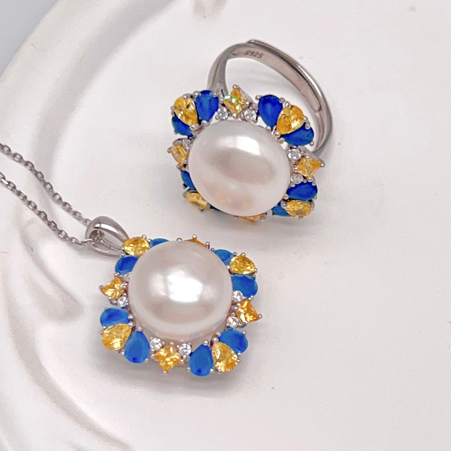 Retro Wind. Pearl Ring and Pendant set in Silver 925. Blue yellow Zircon