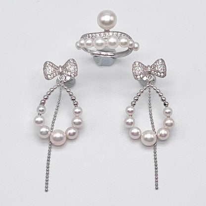Retro Wind. Pearl Earring and Ring set in Silver 925. Bow & Swing