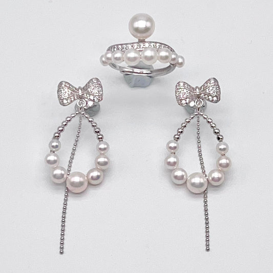 Retro Wind. Pearl Earring and Ring set in Silver 925. Bow & Swing