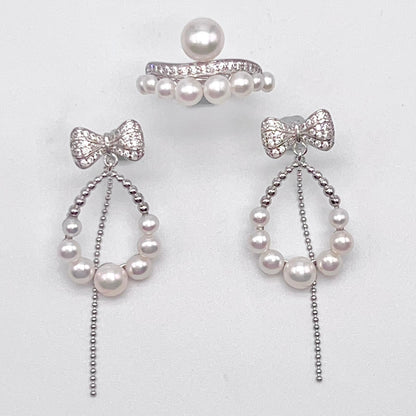 Retro Wind. Pearl Earring and Ring set in Silver 925. Bow & Swing