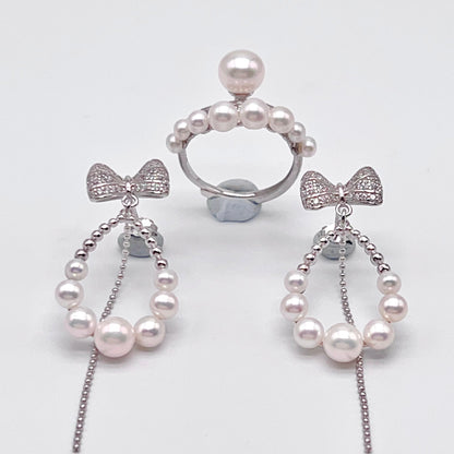 Retro Wind. Pearl Earring and Ring set in Silver 925. Bow & Swing