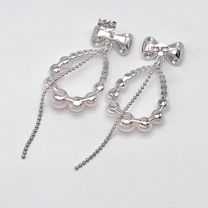 Retro Wind. Pearl Earring and Ring set in Silver 925. Bow & Swing