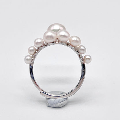 Retro Wind. Pearl Earring and Ring set in Silver 925. Bow & Swing