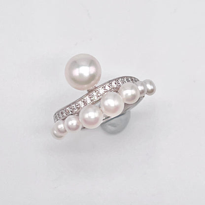 Retro Wind. Pearl Earring and Ring set in Silver 925. Bow & Swing